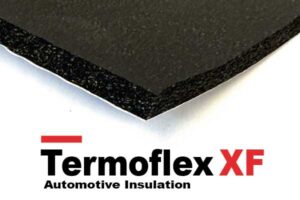 Edge of a black foam insulation board above the Termoflex XF Automotive Insulation logo.